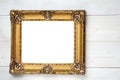 Vintage frame for paintings and photos in empire style on a wooden white background Royalty Free Stock Photo