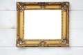 Vintage frame for paintings and photos in empire style on a wooden white background Royalty Free Stock Photo