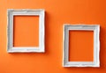 Vintage frames on orange wall