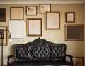 vintage forniture in a livingroom with empty frames