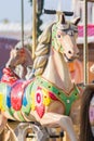 Vintage French colorful carousel in a holiday park. Merry-go-round with horses Royalty Free Stock Photo