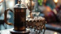 A vintage French press adorned with intricate designs sits elegantly on a side table promising a rich and flavorful cup