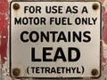 Vintage gas pump lead tetraethyl sign environment Royalty Free Stock Photo