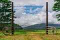 Vintage gate to field with mountains in distance Royalty Free Stock Photo