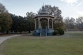 Vintage gazebo in well manicured park on overcast day in the deep south