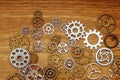 Vintage gear wheels on wooden background Royalty Free Stock Photo