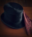 Vintage gentleman`s top hat with a cravat