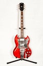 Vintage 1966 Gibson SG standard solid guitar in heritage cherry red color with black batwing pick guard made in original factory Royalty Free Stock Photo