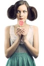 Vintage girl with lollipop, she looks at right Royalty Free Stock Photo