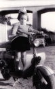 Vintage girl on old scooter Royalty Free Stock Photo