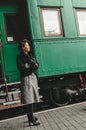 Girl says goodbye on rail platform Royalty Free Stock Photo