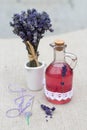 Vintage glass bottle with natural lavender syrup and a bouquet of lavender