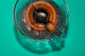 21.03.2020. Kiev, Ukraine. Vintage glass original coffee maker with hot brown beverage and isolated on bright background. Chemex