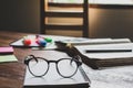 vintage glasses on books stack in public library book, Studying examining Tutor books with friends. Young students campus helps Royalty Free Stock Photo