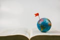 vintage globe with open Bible.