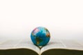 Vintage globe with open Bible Royalty Free Stock Photo