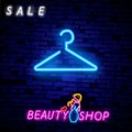 Vintage Glow Signboard with Hanger, Shopping Concept. Atelier, Checkroom, Tailor, Dressmaker, Boutique. Shiny Neon Light Royalty Free Stock Photo