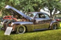 Vintage gold car in a car show outside on a sunny day, Chico, United States