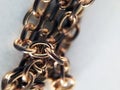 Vintage gold chain closeup fragment on white background. Unity of rings of one chain, concept of unity. Equipment for domestic Royalty Free Stock Photo