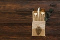 Vintage gold cutlery with eucalyptus an old wooden background. Royalty Free Stock Photo