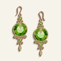 Vintage gold jewelry earrings with green gemstones Royalty Free Stock Photo