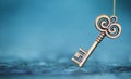 Vintage gold key on blue background Royalty Free Stock Photo