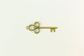 Vintage gold key on white background Royalty Free Stock Photo