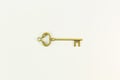 Vintage gold key on white background Royalty Free Stock Photo