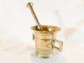 Vintage Gold Mortar for Medicine: Crushing Ingredients on White Background