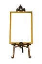 Vintage gold picture frame with wooden easel Royalty Free Stock Photo