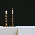 Vintage golden candlestick with burning candles in black interior. 3d render