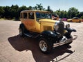 Vintage golden car near the beach