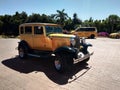 Vintage golden car near the beach