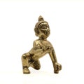 vintage golden figure of crawling baby lord krishna also called gopal Royalty Free Stock Photo