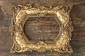 Vintage golden frame on wooden background. Grunge texture Royalty Free Stock Photo