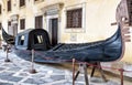 Vintage gondola at Doge`s Palace or Palazzo Ducale, Venice, Italy. Gondola is a most attractive tourist transport of Venice