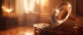 Vintage gramophone with horn speaker in a warm, antique setting Royalty Free Stock Photo