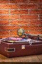 Vintage gramophone on table and background of brickwall