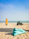 Vintage green ATV on the sandy beach. Quad ATV all terrain vehicle parked on beach, Motor bikes ready for action with summer sun Royalty Free Stock Photo