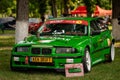 Vintage green BMW car with different modifications at an Auto Tuning Show