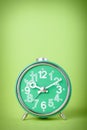 Vintage green clock on green background