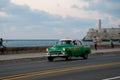 Vintage Havana taxi at dusk on coastal avenue.Cuba.18-05-2015