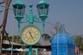 Vintage blue green street clock. Left frame.