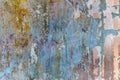 Vintage grunge bright pattern of an old scratched wall with multicolored paint Royalty Free Stock Photo