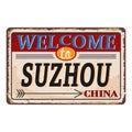 Vintage grunge Welcome to Suzhou China rusted plate on white background