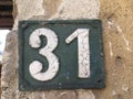 Vintage grunge square metal rusty plate of number of street address with number