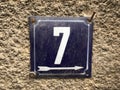 Vintage grunge square metal rusty plate of number of street address with number