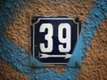 Vintage grunge square metal rusty plate of number of street address Royalty Free Stock Photo