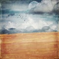 Vintage grunge textured deserted sand dune landscape. Royalty Free Stock Photo