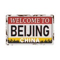 Vintage grunge Welcome to Beijing China rusted plate on white background